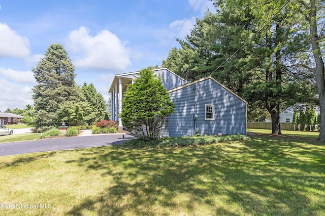2 Eddy Ln, East Greenbush, NY 12144 - view of side of home with a lawn