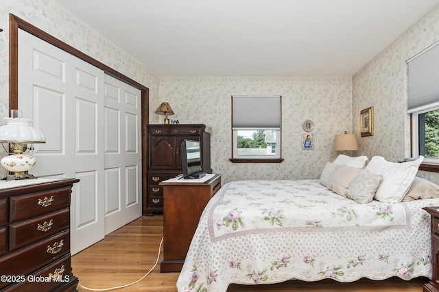2 Eddy Ln, East Greenbush, NY 12144 - bedroom featuring wood finished floors, wallpapered walls, and a closet