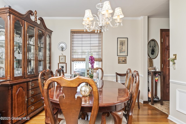 2 Eddy Ln, East Greenbush, NY 12144 - dining area featuring a chandelier, light wood-style flooring, and crown molding