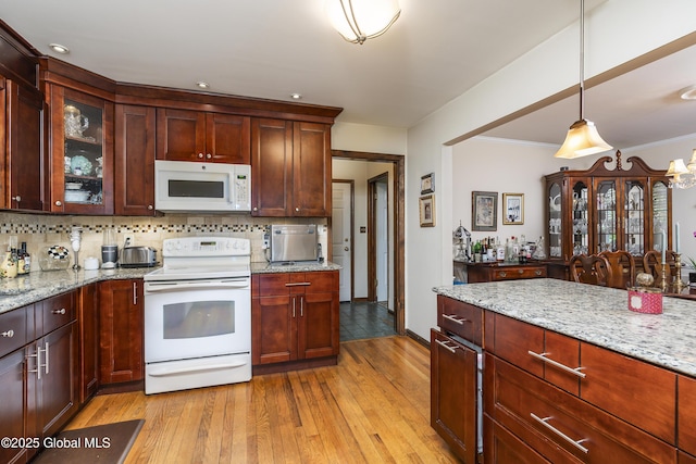 2 Eddy Ln, East Greenbush, NY 12144 - kitchen featuring white appliances, light wood-style flooring, decorative backsplash, glass insert cabinets, and crown molding