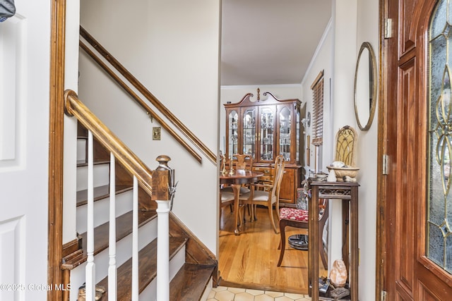 2 Eddy Ln, East Greenbush, NY 12144 - entrance foyer with stairway, ornamental molding, and tile patterned floors