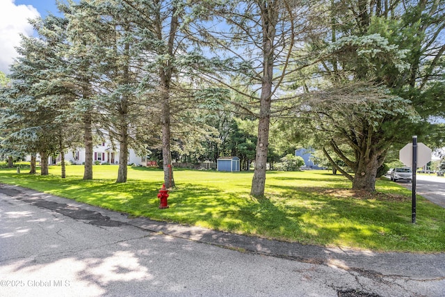 2 Eddy Ln, East Greenbush, NY 12144 - view of community with a storage shed and a yard
