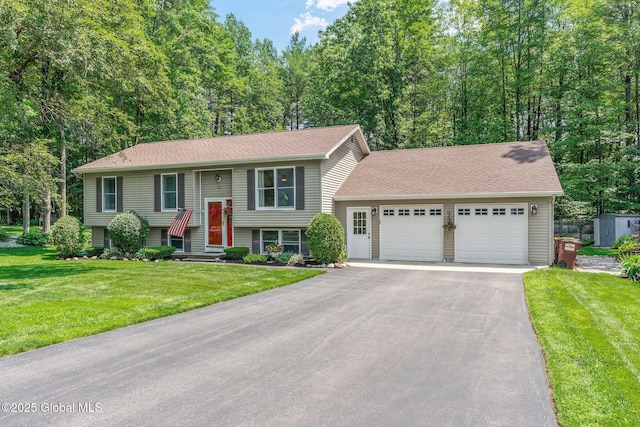 25 Mockingbird Ln, Queensbury, NY 12804 - bi-level home featuring a front yard, a garage, driveway, and a shingled roof