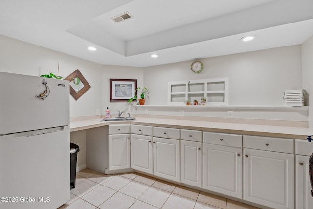25 Mockingbird Ln, Queensbury, NY 12804 - kitchen featuring freestanding refrigerator, recessed lighting, light tile patterned flooring, and light countertops