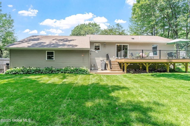 25 Mockingbird Ln, Queensbury, NY 12804 - rear view of property featuring a wooden deck and a lawn