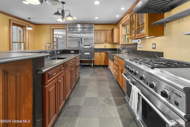 359 Wall St, Northumberland, NY 12871 - kitchen featuring premium appliances, a chandelier, ornamental molding, ventilation hood, and brown cabinets