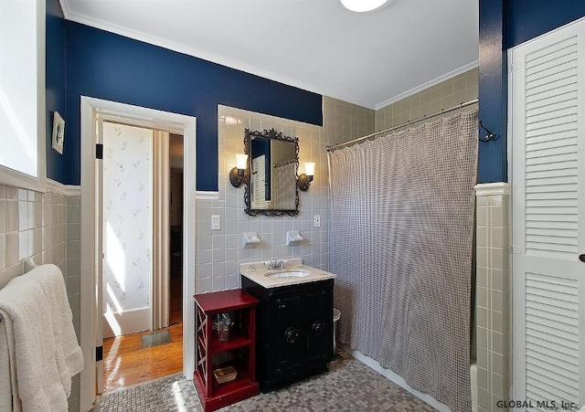 359 Wall St, Northumberland, NY 12871 - full bathroom featuring tile walls, vanity, crown molding, and wainscoting