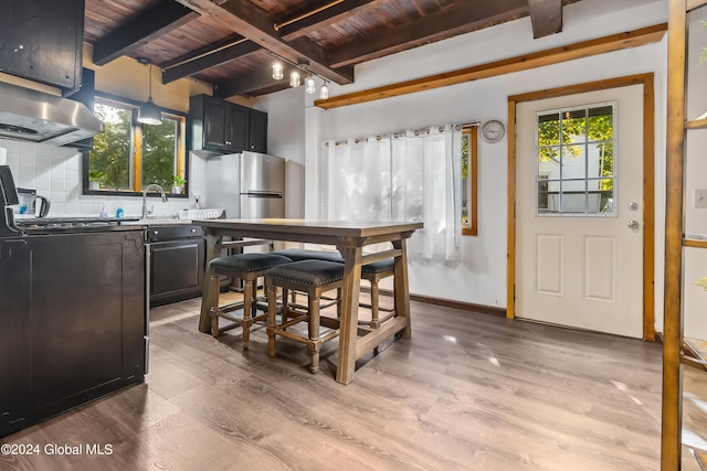 359 Wall St, Northumberland, NY 12871 - dining space featuring healthy amount of natural light, light wood finished floors, and a wooden ceiling with exposed beams