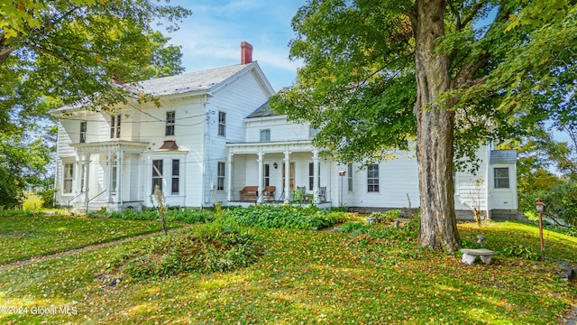 359 Wall St, Northumberland, NY 12871 - view of front of home with a porch and a chimney