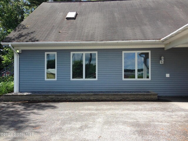 336 State Route 29, Greenwich, NY 12834 - view of side of home featuring roof with shingles