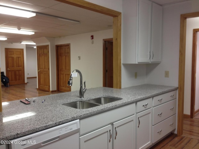 336 State Route 29, Greenwich, NY 12834 - kitchen featuring dishwasher, light wood-style floors, white cabinets, and light stone counters