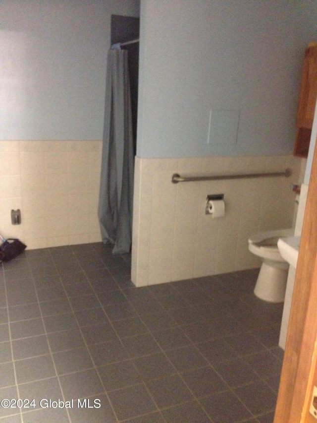 336 State Route 29, Greenwich, NY 12834 - full bathroom with tile walls, wainscoting, tile patterned flooring, and a shower with curtain