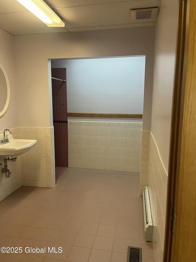 336 State Route 29, Greenwich, NY 12834 - bathroom with tile walls, wainscoting, and tile patterned flooring