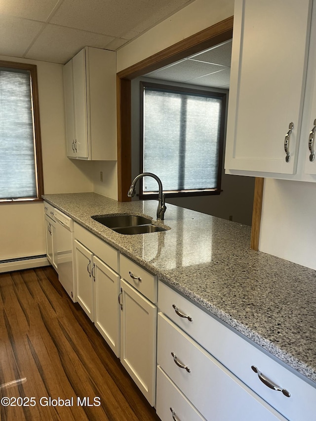 336 State Route 29, Greenwich, NY 12834 - kitchen featuring white dishwasher, white cabinetry, healthy amount of natural light, light stone countertops, and a paneled ceiling