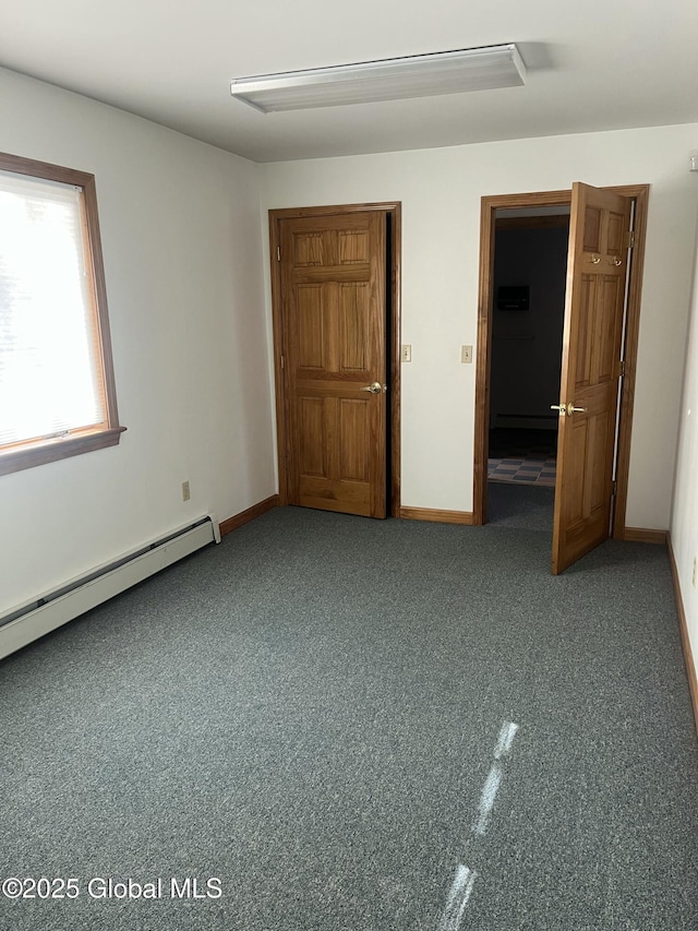 336 State Route 29, Greenwich, NY 12834 - unfurnished bedroom featuring a baseboard radiator and baseboards