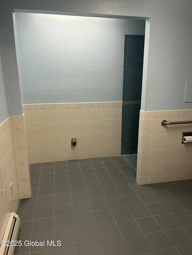 336 State Route 29, Greenwich, NY 12834 - bathroom with baseboard heating, tile patterned flooring, tile walls, tiled shower, and a wainscoted wall