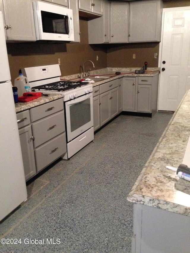 336 State Route 29, Greenwich, NY 12834 - kitchen with white appliances, gray cabinetry, and light countertops