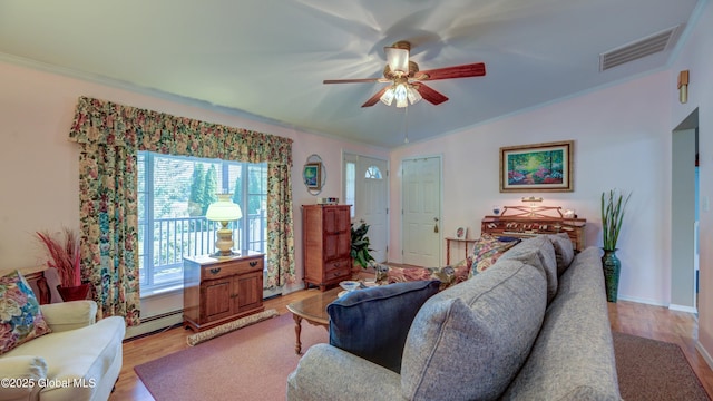 88 County Route 26a, Stuyvesant, NY 12173 - living area featuring baseboard heating, ceiling fan, crown molding, light wood finished floors, and lofted ceiling