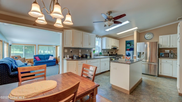 88 County Route 26a, Stuyvesant, NY 12173 - kitchen with appliances with stainless steel finishes, ceiling fan, a kitchen island, ornamental molding, and white cabinetry