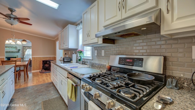 88 County Route 26a, Stuyvesant, NY 12173 - kitchen featuring stainless steel appliances, under cabinet range hood, ceiling fan, ornamental molding, and wainscoting