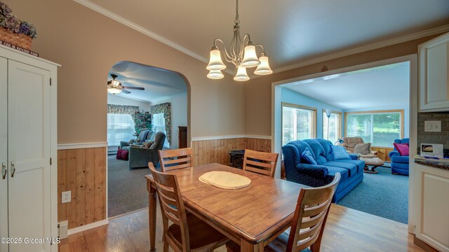 88 County Route 26a, Stuyvesant, NY 12173 - dining space featuring light wood-type flooring, vaulted ceiling, a wainscoted wall, a chandelier, and crown molding