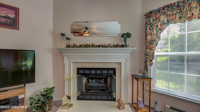 88 County Route 26a, Stuyvesant, NY 12173 - detailed view of a baseboard radiator, a fireplace, carpet, and ceiling fan