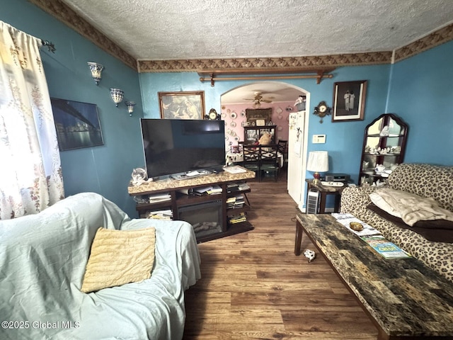 27 Sloan St, Albany, NY 12202 - living room with a textured ceiling, wood finished floors, and arched walkways