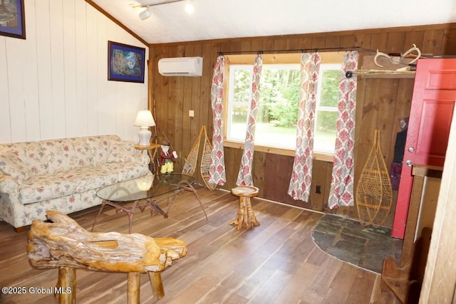 469 Military Rd, Edinburg, NY 12134 - living area with wood-type flooring, lofted ceiling, a wall mounted AC, and wooden walls