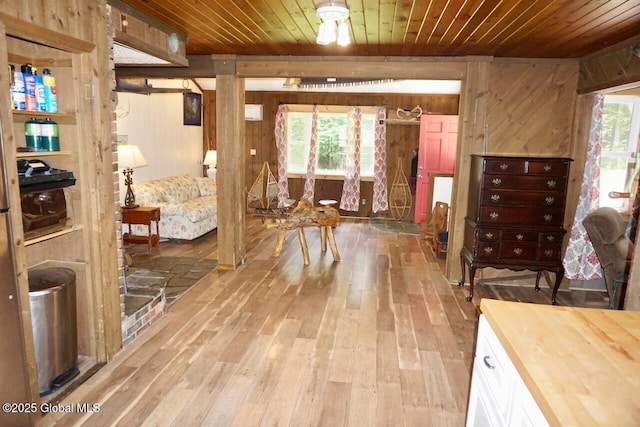 469 Military Rd, Edinburg, NY 12134 - hall with wooden ceiling, wooden walls, and light wood-type flooring