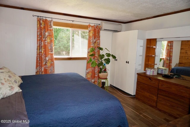 469 Military Rd, Edinburg, NY 12134 - bedroom with a wall unit AC, wood finished floors, a textured ceiling, and crown molding