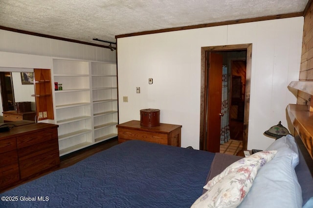 469 Military Rd, Edinburg, NY 12134 - bedroom featuring a textured ceiling, ornamental molding, a barn door, and wooden walls