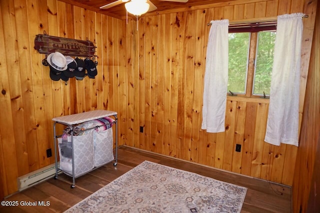 469 Military Rd, Edinburg, NY 12134 - bedroom featuring wood finished floors, baseboard heating, and wooden walls