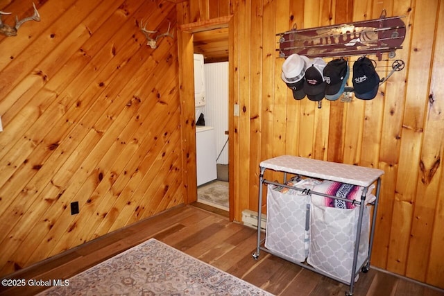 469 Military Rd, Edinburg, NY 12134 - mudroom with wood finished floors, wooden walls, and a baseboard heating unit