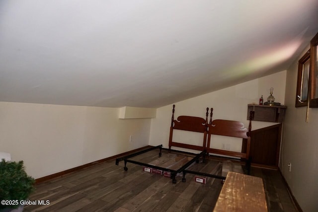 469 Military Rd, Edinburg, NY 12134 - bedroom with dark wood-type flooring and lofted ceiling