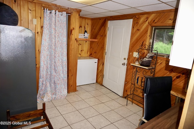 469 Military Rd, Edinburg, NY 12134 - laundry room featuring wood walls and tile patterned flooring