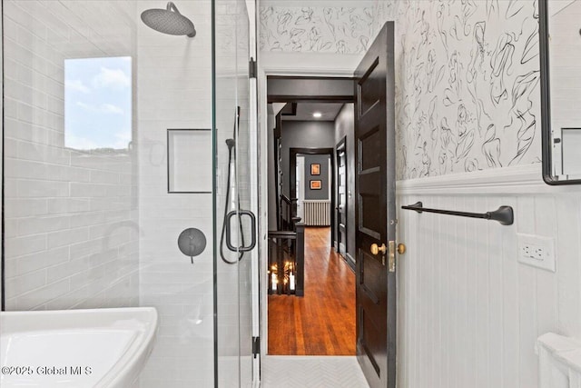 218 Lancaster St, Albany, NY 12210 - bathroom featuring a stall shower, a wainscoted wall, and radiator heating unit