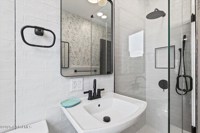 218 Lancaster St, Albany, NY 12210 - bathroom with tile walls, a stall shower, and backsplash