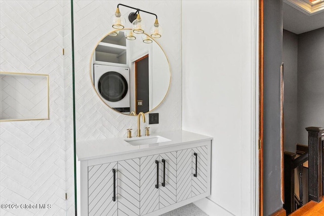 218 Lancaster St, Albany, NY 12210 - bathroom featuring stacked washing machine and dryer and vanity
