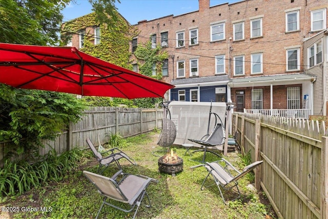 218 Lancaster St, Albany, NY 12210 - fenced backyard with an outdoor fire pit