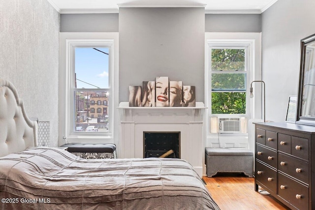 218 Lancaster St, Albany, NY 12210 - bedroom featuring wood finished floors, crown molding, a fireplace, and cooling unit