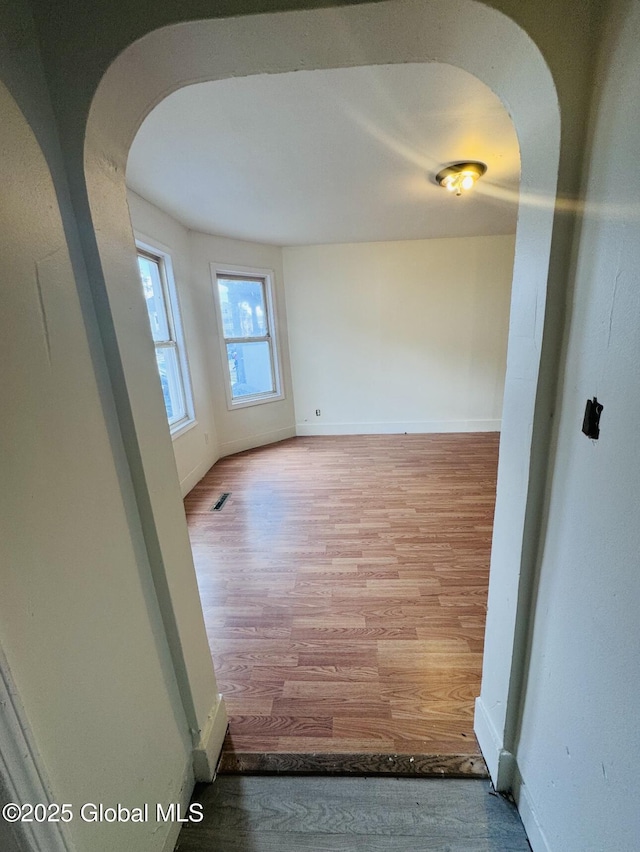 918-922 Bridge St, Schenectady, NY 12303 - empty room featuring arched walkways and wood finished floors