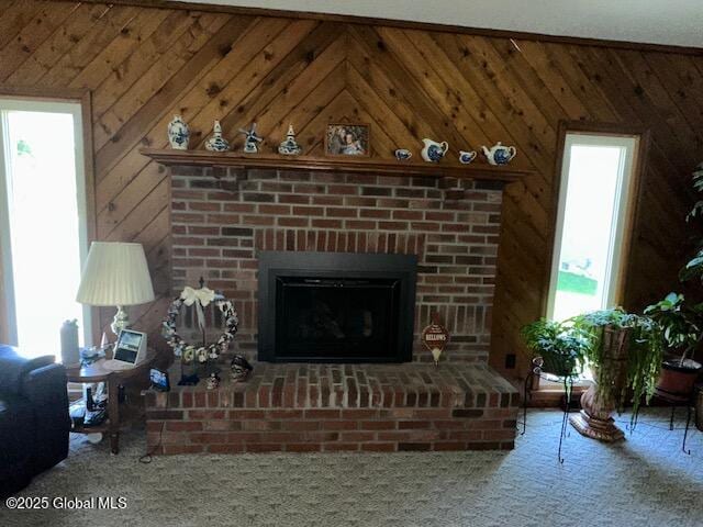 12 Bain Dr, Bethlehem, NY 12054 - living area featuring healthy amount of natural light, wooden walls, and a fireplace