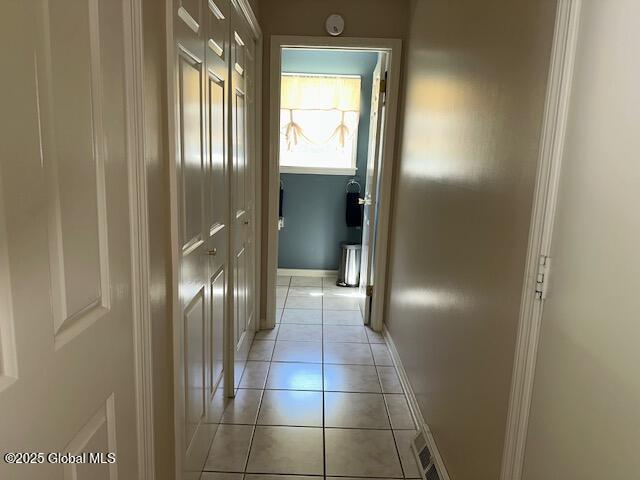 12 Bain Dr, Bethlehem, NY 12054 - hall featuring light tile patterned floors and baseboards