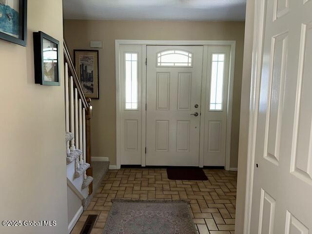 12 Bain Dr, Bethlehem, NY 12054 - entryway featuring stairs and brick patterned floors