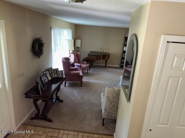 12 Bain Dr, Bethlehem, NY 12054 - carpeted living room featuring baseboards