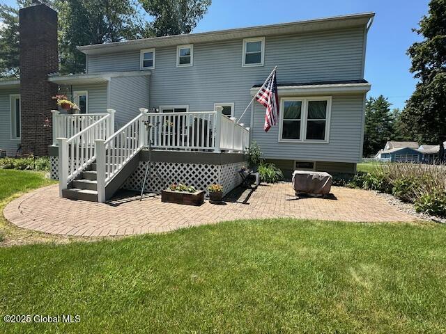 12 Bain Dr, Bethlehem, NY 12054 - rear view of house featuring a patio area, a yard, and a deck