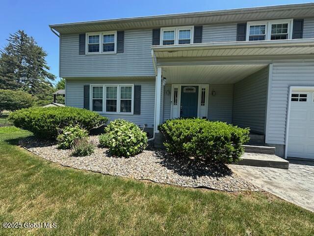 12 Bain Dr, Bethlehem, NY 12054 - view of front facade featuring a front lawn