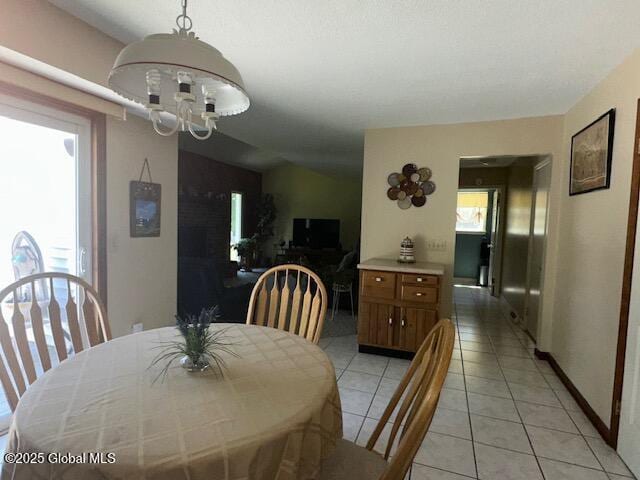 12 Bain Dr, Bethlehem, NY 12054 - dining space with light tile patterned floors and a chandelier