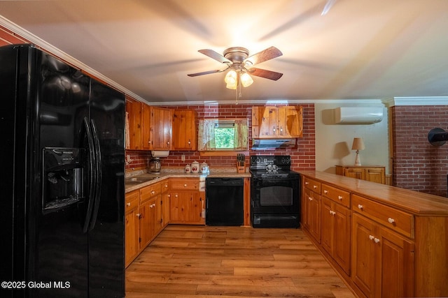64 Coon Ln, Salem, NY 12865 - kitchen with black appliances, ventilation hood, a peninsula, light wood-style floors, and a ceiling fan
