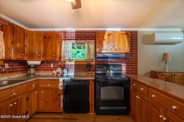 64 Coon Ln, Salem, NY 12865 - kitchen with black appliances, under cabinet range hood, brown cabinets, a wall mounted air conditioner, and light wood finished floors